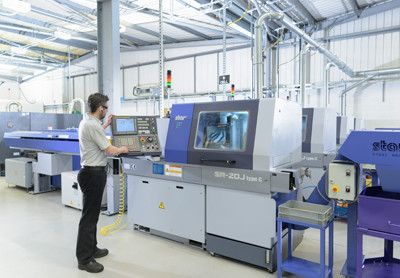 Sliding head CNC machining